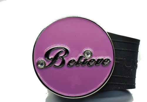 Pink ball marker with the cursive word 