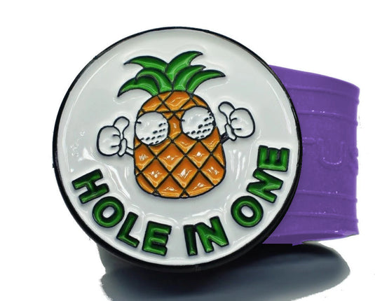 Hole in One Pineapple golf ball marker on a Purple InfusenClip™