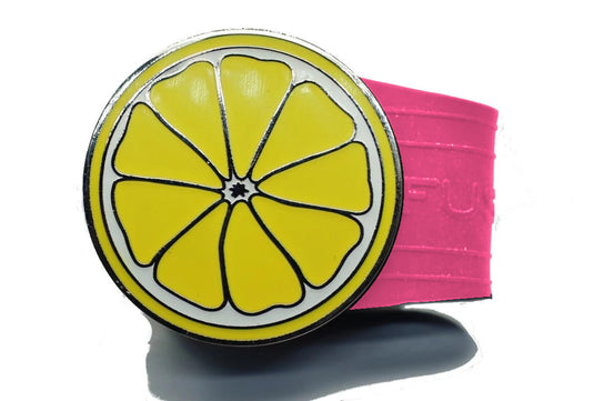 Lemon golf ball marker on a Pink InfusenClip™